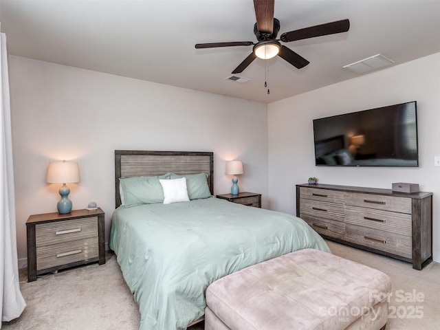 bedroom featuring light colored carpet, a ceiling fan, and visible vents