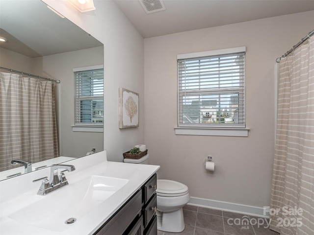 full bathroom with plenty of natural light, toilet, visible vents, and tile patterned floors