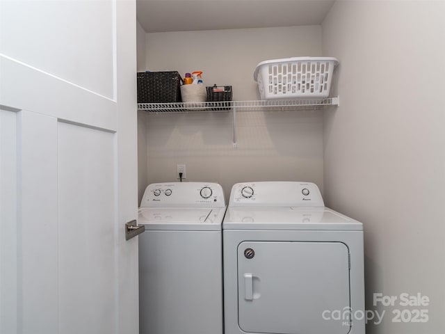 laundry room featuring washer and dryer and laundry area
