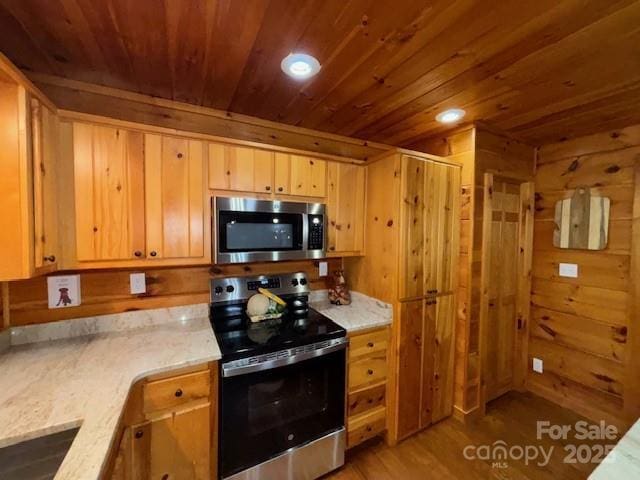 926 Cross Creek Dr, Rutherfordton, NC 28139 - kitchen featuring stainless steel appliances, wood ceiling, light wood-type flooring, recessed lighting, and light stone counters