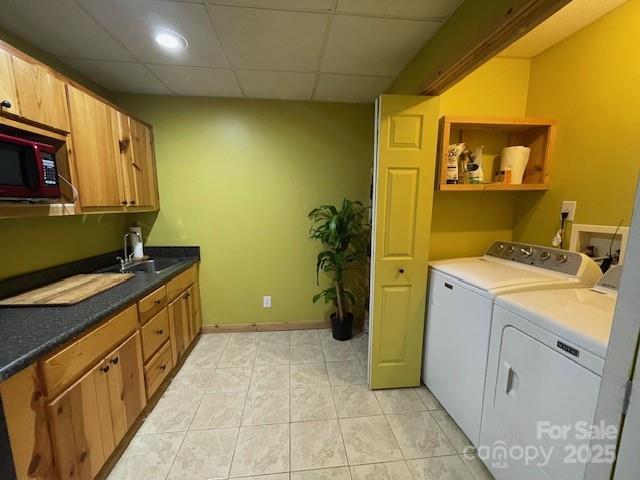 926 Cross Creek Dr, Rutherfordton, NC 28139 - laundry area with washing machine and dryer, light tile patterned flooring, cabinet space, baseboards, and recessed lighting