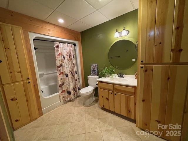 926 Cross Creek Dr, Rutherfordton, NC 28139 - full bath with toilet, tile patterned flooring, vanity, shower / tub combo with curtain, and wood walls