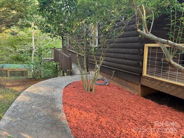 926 Cross Creek Dr, Rutherfordton, NC 28139 - exterior view of fence and log veneer siding