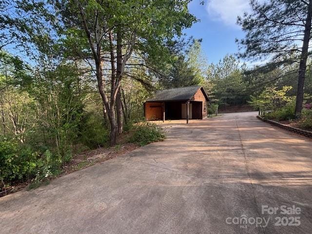 926 Cross Creek Dr, Rutherfordton, NC 28139 - exterior space with a detached garage, driveway, and an outdoor structure