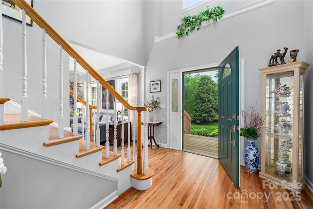 148 Broyles Rd, Hendersonville, NC 28791 - foyer with stairway, wood finished floors, and a high ceiling