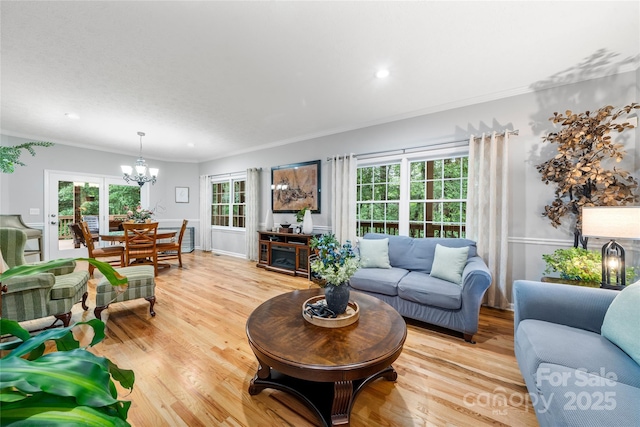 148 Broyles Rd, Hendersonville, NC 28791 - living area with a chandelier, crown molding, light wood-style flooring, plenty of natural light, and recessed lighting
