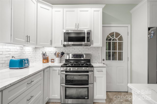 148 Broyles Rd, Hendersonville, NC 28791 - kitchen featuring appliances with stainless steel finishes, backsplash, and white cabinets