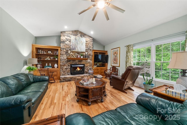 148 Broyles Rd, Hendersonville, NC 28791 - living room featuring wood finished floors, ceiling fan, vaulted ceiling, and a fireplace