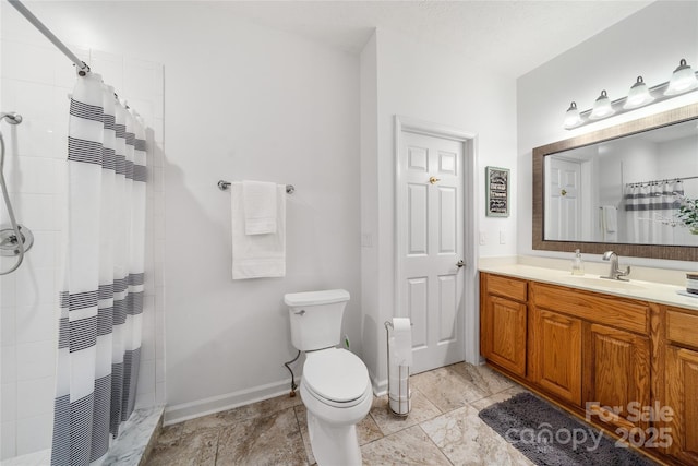 148 Broyles Rd, Hendersonville, NC 28791 - bathroom featuring vanity, tiled shower, toilet, and baseboards