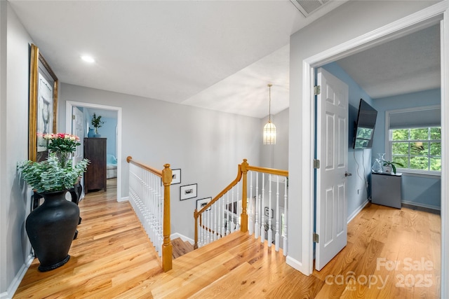 148 Broyles Rd, Hendersonville, NC 28791 - hall featuring an upstairs landing, wood finished floors, baseboards, and recessed lighting