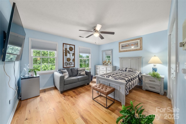 148 Broyles Rd, Hendersonville, NC 28791 - bedroom with baseboards, light wood-type flooring, and ceiling fan