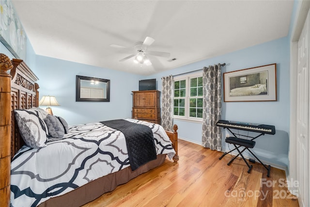 148 Broyles Rd, Hendersonville, NC 28791 - bedroom featuring wood finished floors, ceiling fan, baseboards, and a closet