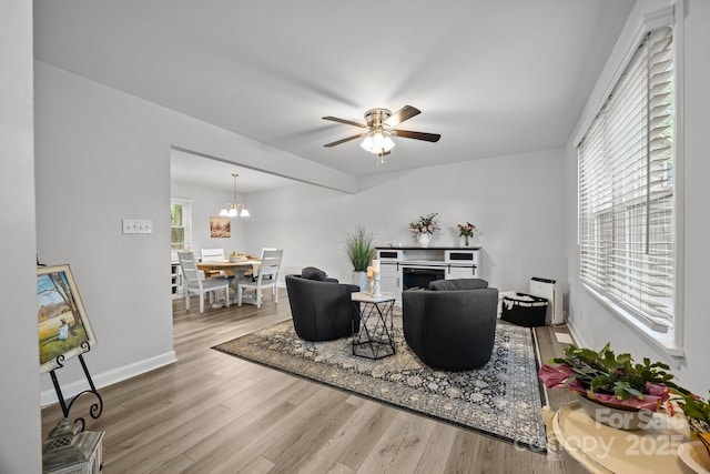 130 Cherokee Ln, Salisbury, NC 28147 - living room with wood finished floors, a fireplace, ceiling fan, baseboards, and a chandelier