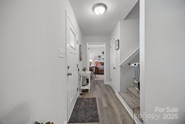 130 Cherokee Ln, Salisbury, NC 28147 - corridor featuring wood finished floors, stairway, and baseboards