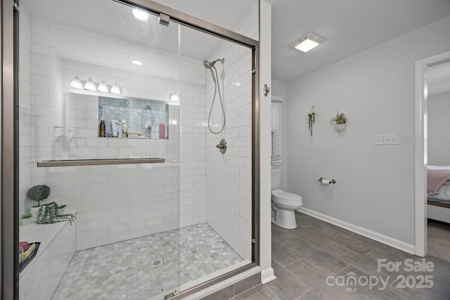130 Cherokee Ln, Salisbury, NC 28147 - full bath with a shower stall, toilet, baseboards, and connected bathroom