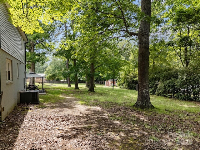 130 Cherokee Ln, Salisbury, NC 28147 - view of yard featuring central AC and view of scattered trees