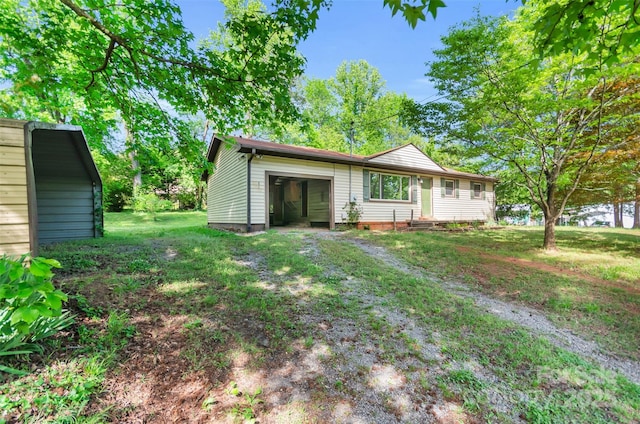view of front facade with a front yard and a garage