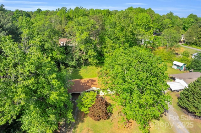 bird's eye view featuring a view of trees