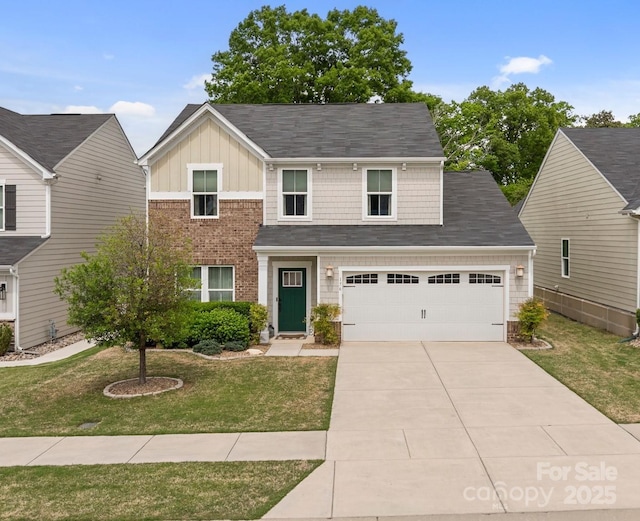 176 Jennymarie Rd, Mooresville, NC 28115 - view of front of house featuring board and batten siding, brick siding, a front lawn, and driveway