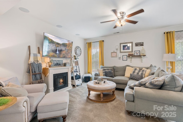 176 Jennymarie Rd, Mooresville, NC 28115 - carpeted living room with ceiling fan and a glass covered fireplace