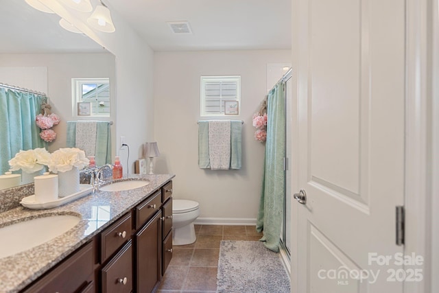 176 Jennymarie Rd, Mooresville, NC 28115 - full bath featuring double vanity, toilet, baseboards, tile patterned floors, and a shower with curtain
