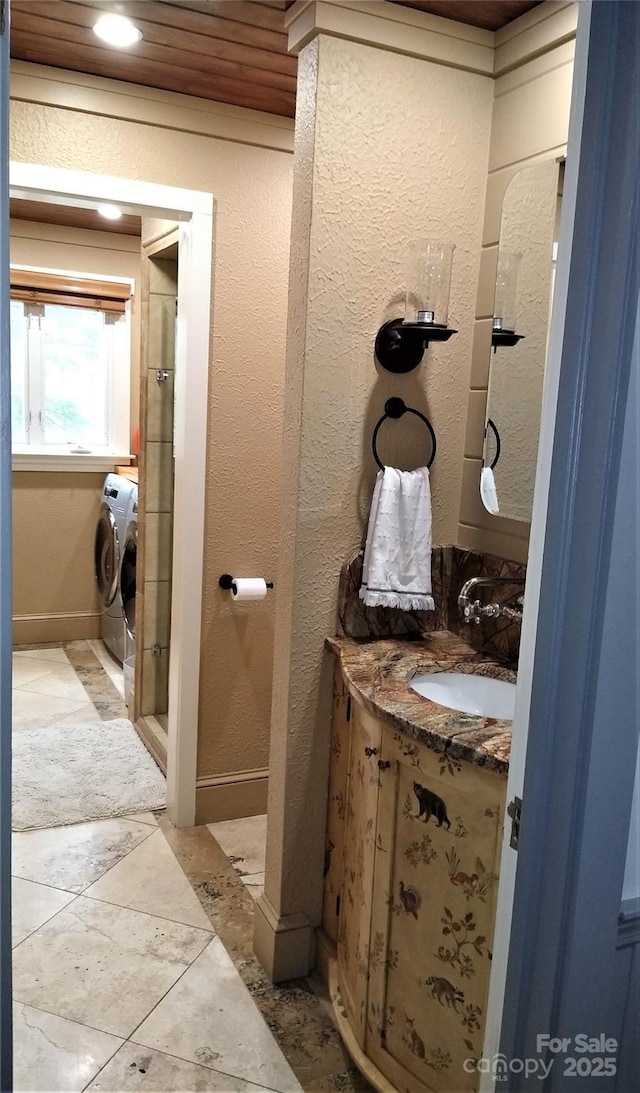 242 Birch Ln, Arden, NC 28704 - full bath featuring vanity, a textured wall, washer and dryer, recessed lighting, and a shower stall