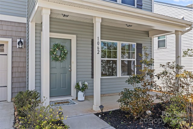 property entrance featuring covered porch