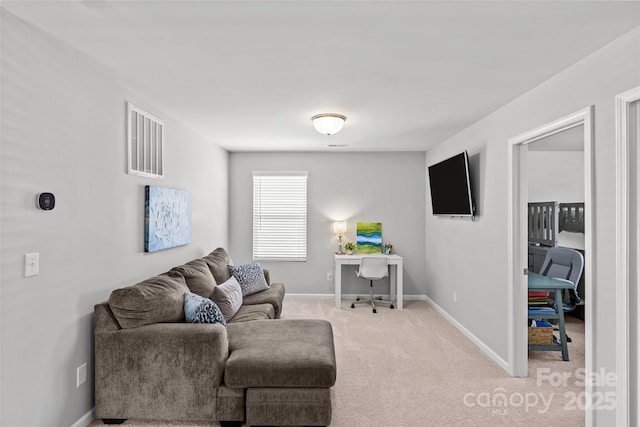 living room with light colored carpet and baseboards