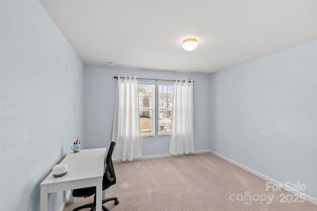 office with light carpet and baseboards