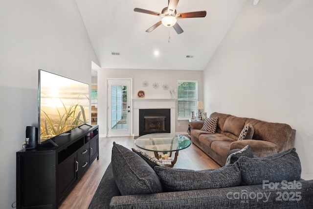9200 Forest Green Dr, Charlotte, NC 28227 - living room featuring light wood-type flooring, visible vents, a fireplace, and ceiling fan