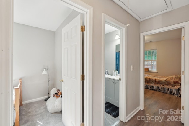 9200 Forest Green Dr, Charlotte, NC 28227 - bathroom featuring baseboards, vanity, and wood finished floors