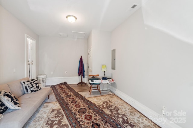 9200 Forest Green Dr, Charlotte, NC 28227 - living room featuring baseboards, visible vents, wood finished floors, and electric panel
