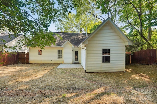 9200 Forest Green Dr, Charlotte, NC 28227 - back of house featuring fence, a patio, and a shingled roof