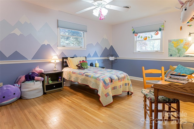 bedroom with wood finished floors