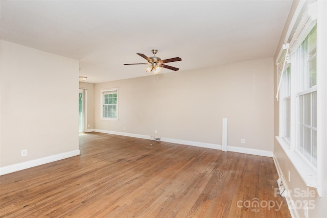 1532 Downs Ave, Charlotte, NC 28205 - spare room with ceiling fan, baseboards, visible vents, and light wood-type flooring