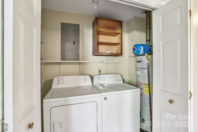 laundry area featuring electric panel, separate washer and dryer, gas water heater, and laundry area