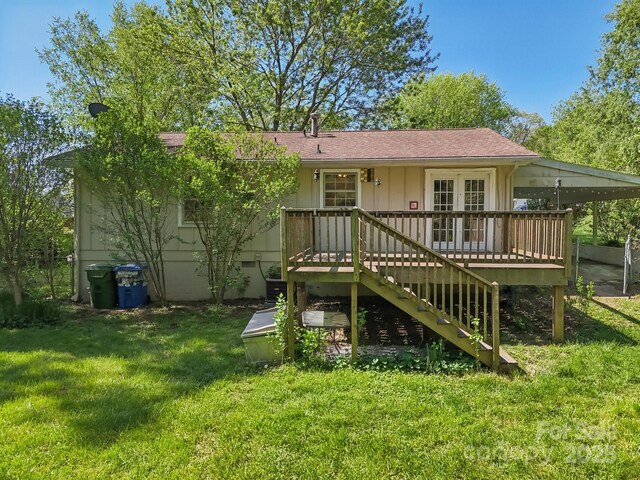 back of house with a yard and a deck