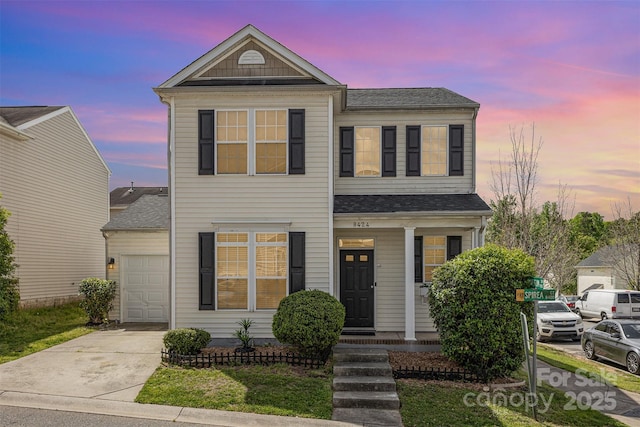 8424 Spirea Ct, Charlotte, NC 28215 - traditional home featuring driveway, covered porch, a shingled roof, and a garage
