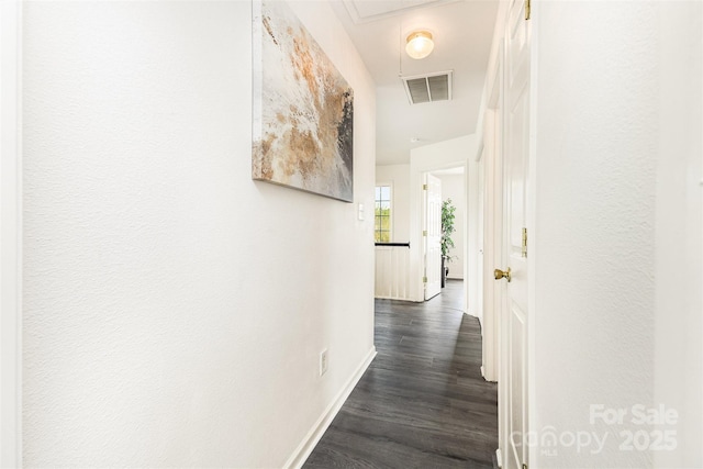 8424 Spirea Ct, Charlotte, NC 28215 - hall featuring attic access, visible vents, dark wood finished floors, and baseboards