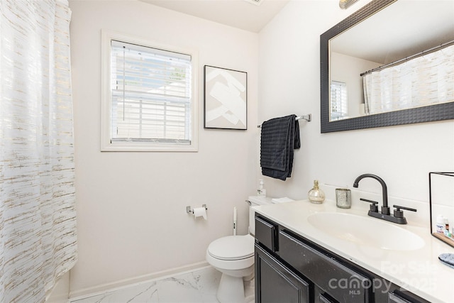 8424 Spirea Ct, Charlotte, NC 28215 - bathroom featuring marble finish floor, a shower with shower curtain, toilet, vanity, and baseboards