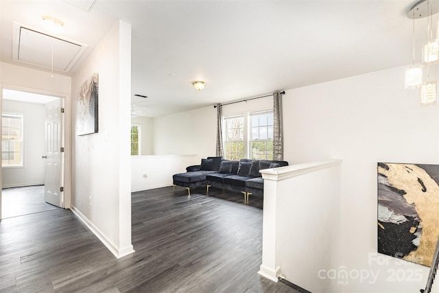8424 Spirea Ct, Charlotte, NC 28215 - corridor featuring attic access, a wealth of natural light, dark wood finished floors, and baseboards