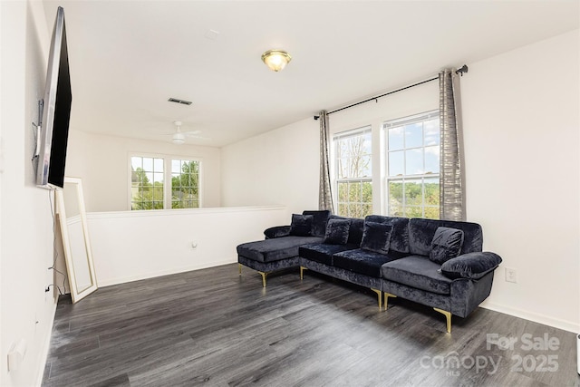 8424 Spirea Ct, Charlotte, NC 28215 - living room featuring dark wood-style floors, visible vents, a ceiling fan, and baseboards