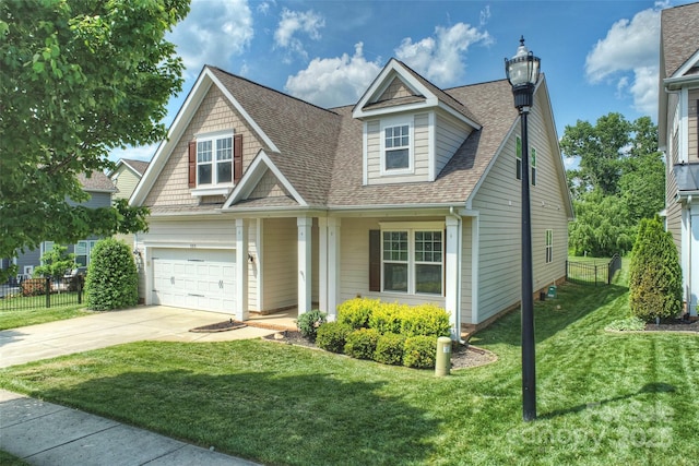 505 Chamberlain Ct, Mcadenville, NC 28101 - view of front facade featuring driveway, a front yard, roof with shingles, a garage, and fence