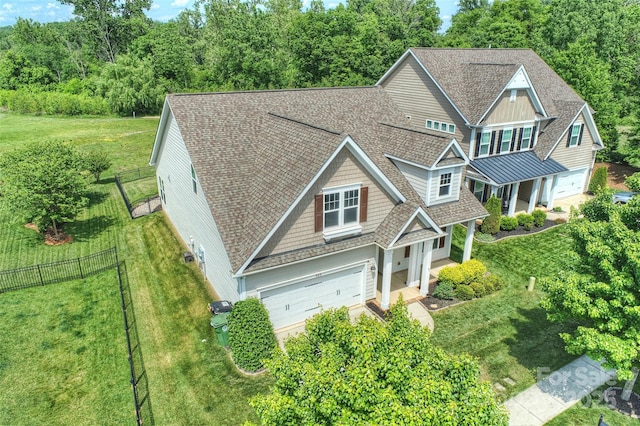 505 Chamberlain Ct, Mcadenville, NC 28101 - view of front of home featuring fence, a shingled roof, a garage, and a front yard