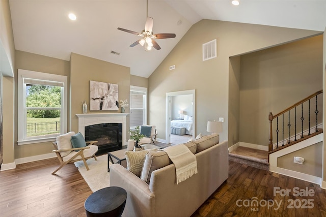 505 Chamberlain Ct, Mcadenville, NC 28101 - living area featuring visible vents, dark wood-type flooring, a glass covered fireplace, and ceiling fan