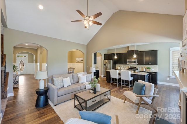 505 Chamberlain Ct, Mcadenville, NC 28101 - living area with arched walkways, a ceiling fan, dark wood finished floors, and high vaulted ceiling