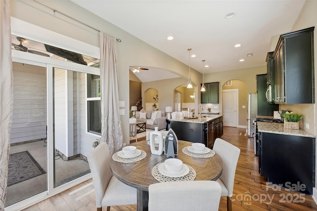 505 Chamberlain Ct, Mcadenville, NC 28101 - dining space featuring arched walkways, ceiling fan, recessed lighting, and light wood finished floors