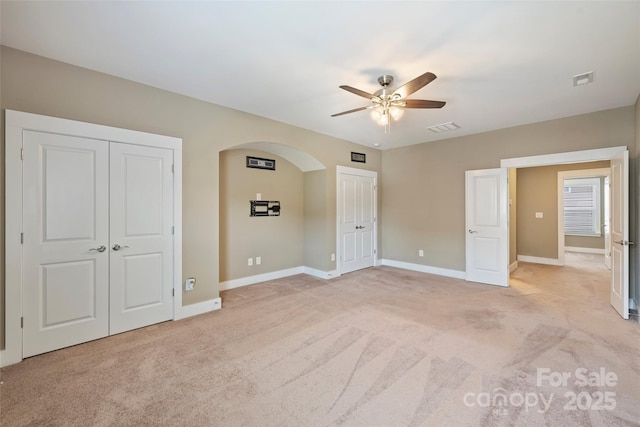 505 Chamberlain Ct, Mcadenville, NC 28101 - unfurnished bedroom with light colored carpet, baseboards, visible vents, and arched walkways