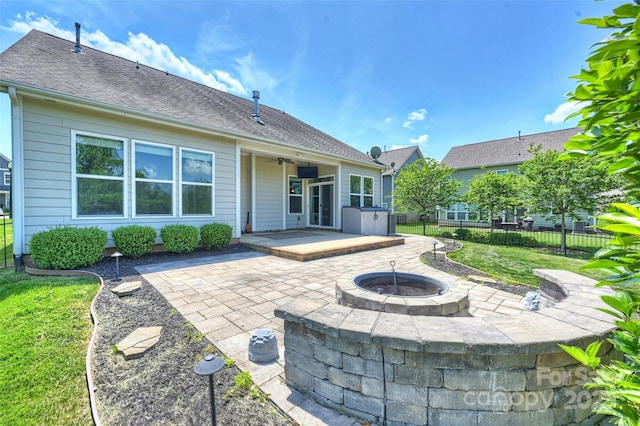 505 Chamberlain Ct, Mcadenville, NC 28101 - back of house featuring a patio, a ceiling fan, a fire pit, and fence