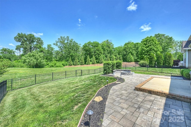 505 Chamberlain Ct, Mcadenville, NC 28101 - view of yard with a fenced backyard, a patio, and a fire pit